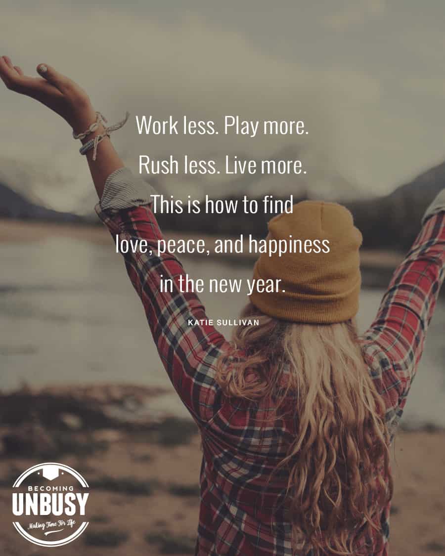 Woman standing with her arms wide open in front of mountains with this quote over the photo: Work less. Play more. Rush less. Live more.