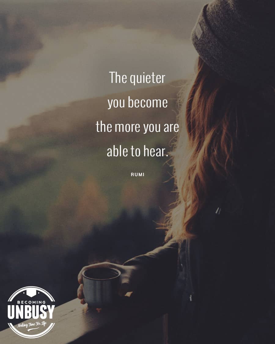 Woman sitting looking out on the mountains drinking coffee with the quote reading, "The quieter you become the more you are able to hear."