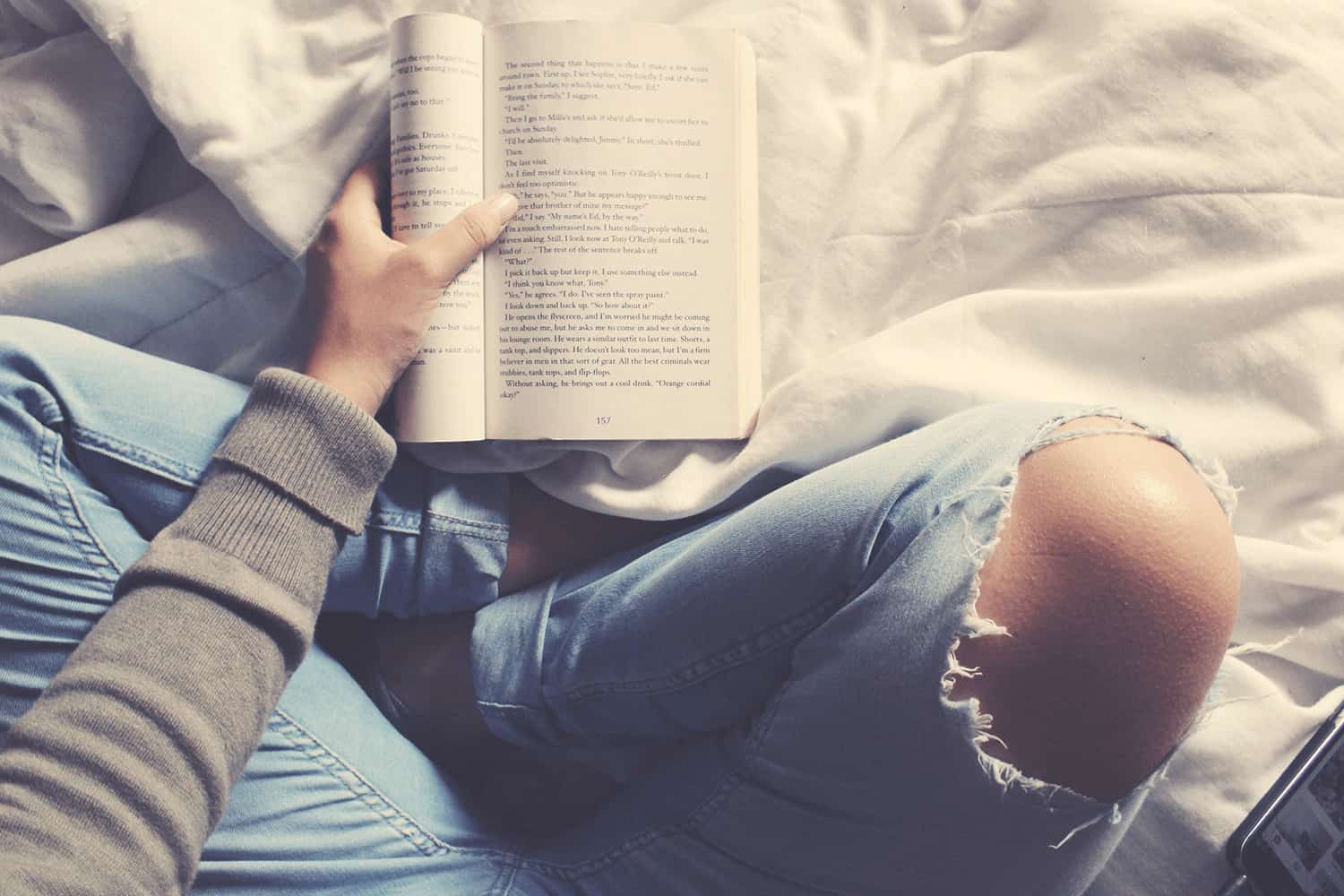 Woman in White Dress Lying Down and Reading Book on Picnic · Free Stock  Photo