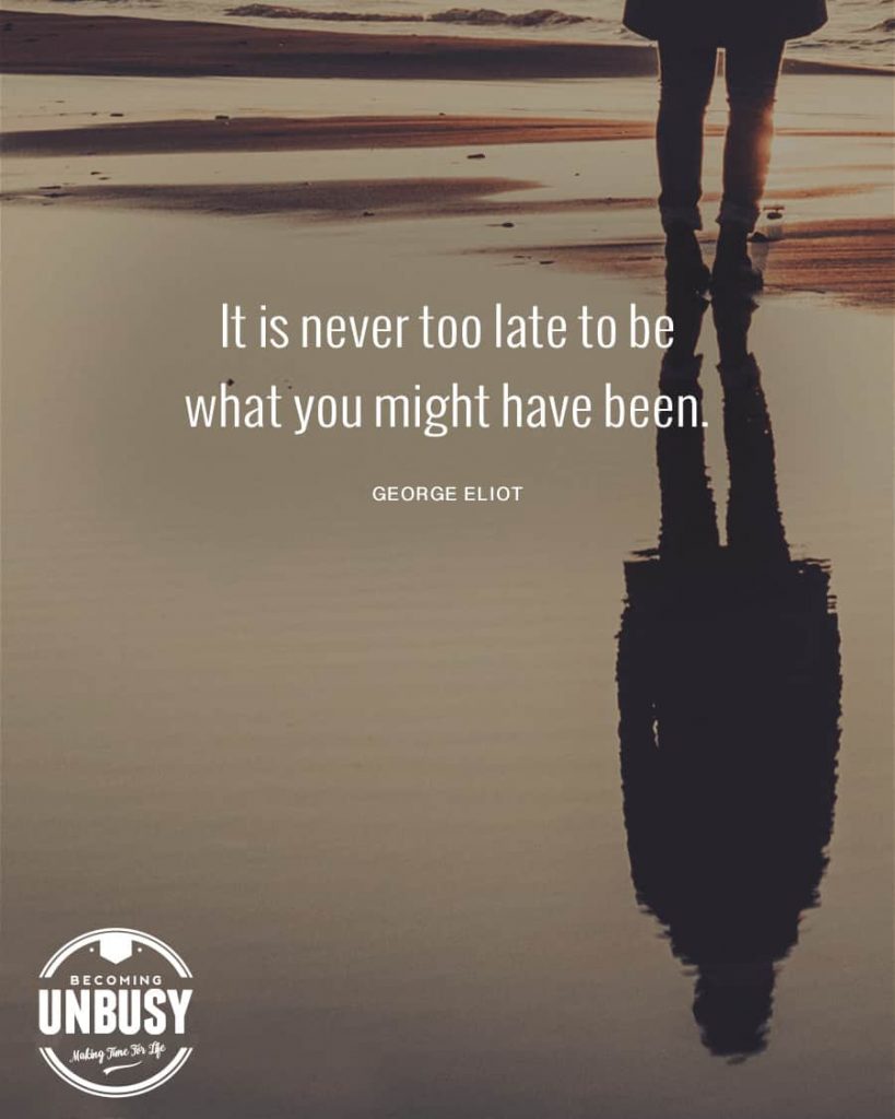 A woman looking at her reflection in the water with a quote about how to start over overtop the image reading, "It's never too late to be might what you might have been." 