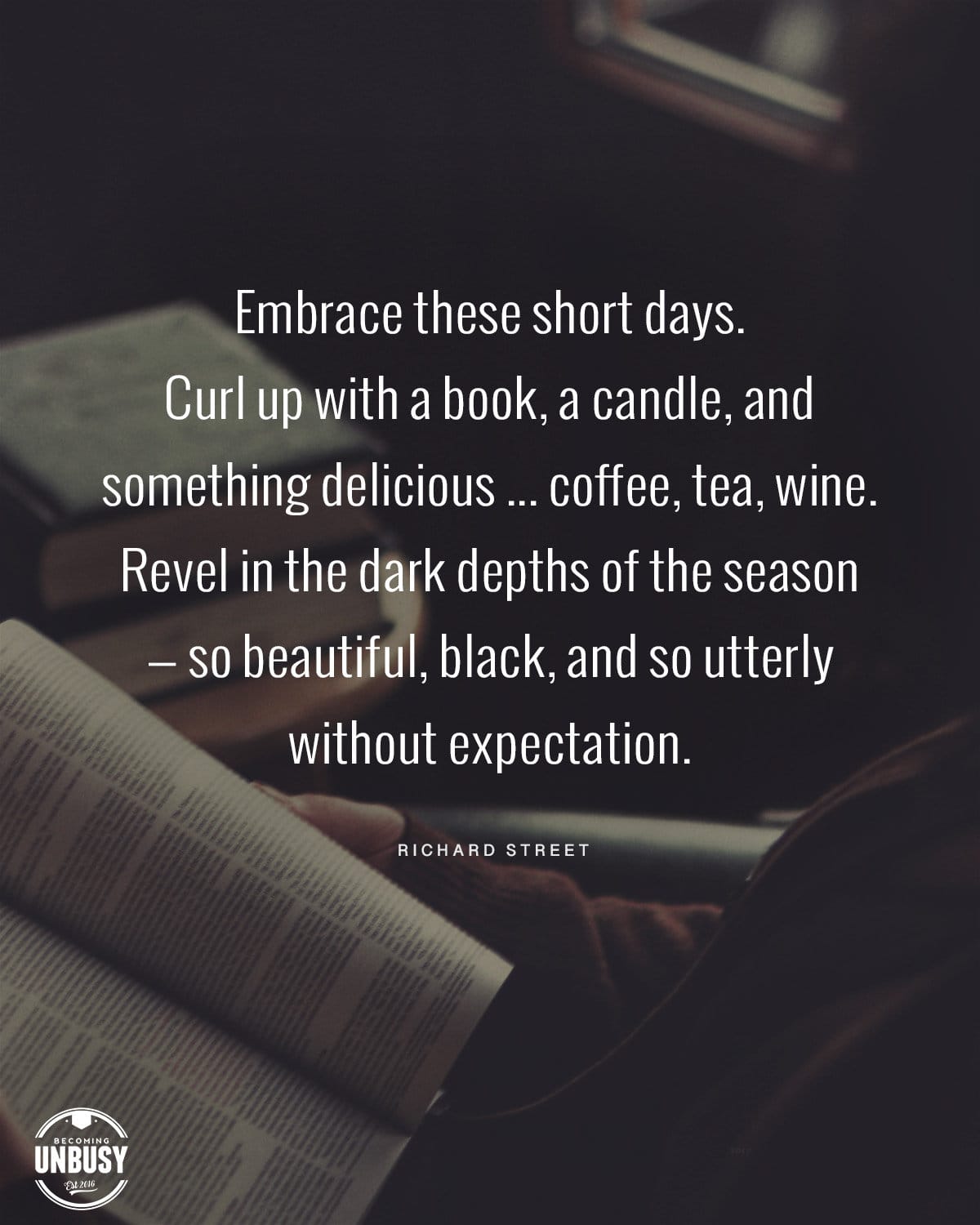 The following fall bucket list quote written over a photo of a woman reading in the dark lamp side, "Embrace these short days. Curl up with a book, a candle, and something delicious ... coffee, tea, wine. Revel in the dark depths of the season — so beautiful, black, and so utterly without expectation." 