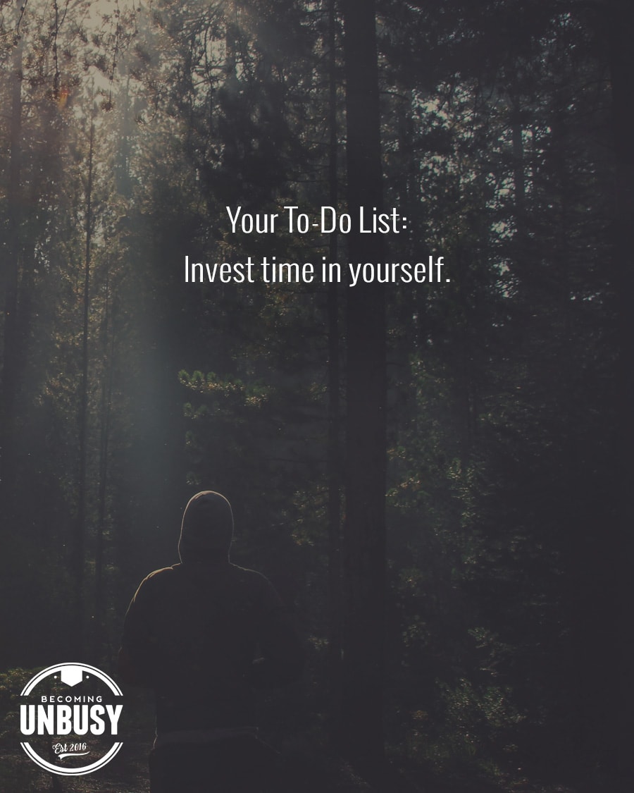 The following fall bucket list quote written over a photo of a person quietly walking alone in the woods, "Your to do list: Invest in time in yourself."