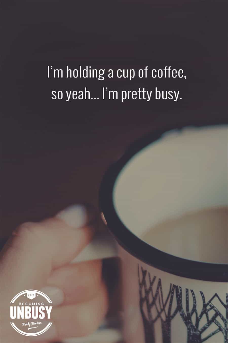 The following winter self-care quote over a photo of a woman holding a cup of hot coffee, "I'm holding a cup of coffee, so yeah... I'm pretty busy."